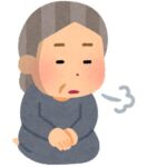 高齢者女性ため息